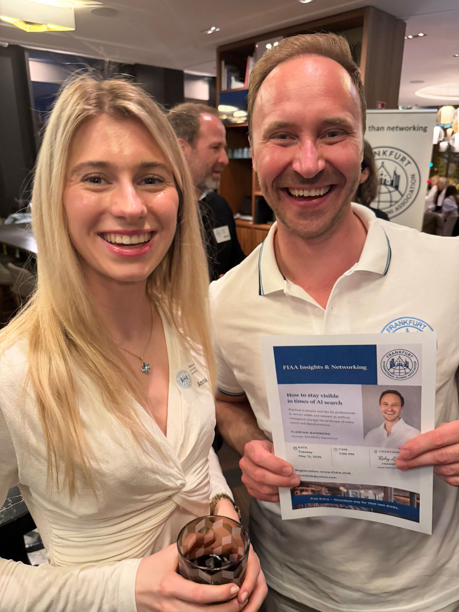 FIAA member holding the flyer for the next event with Florian Bamberg
